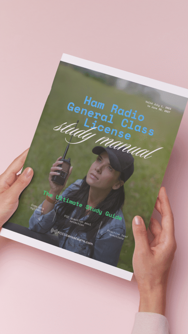 a woman's hands holding the ham radio general license manual